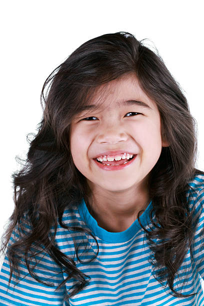 istock Happy seven year old girl smiling 153689040