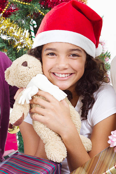 istock Christmas girl with presents 153689098