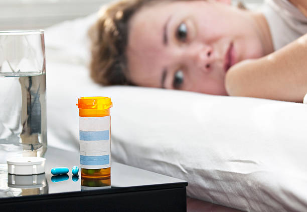 women in a bed stock photo