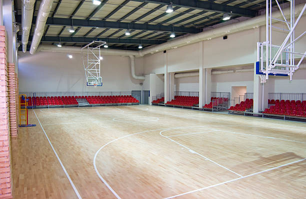 Photography of a large and empty basketball stadium basketball hall school bleachers stock pictures, royalty-free photos & images