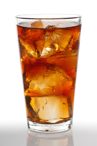 Glass of iced tea with ice cubes and condensation on the glass