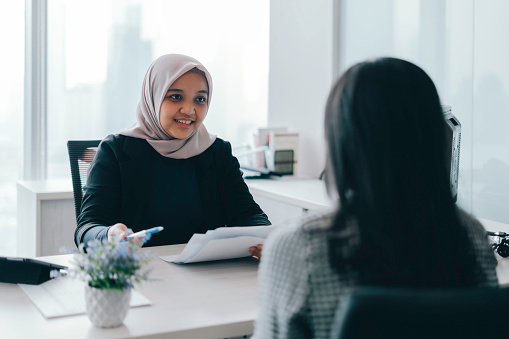 portrait of happy business woman in job interview at the office