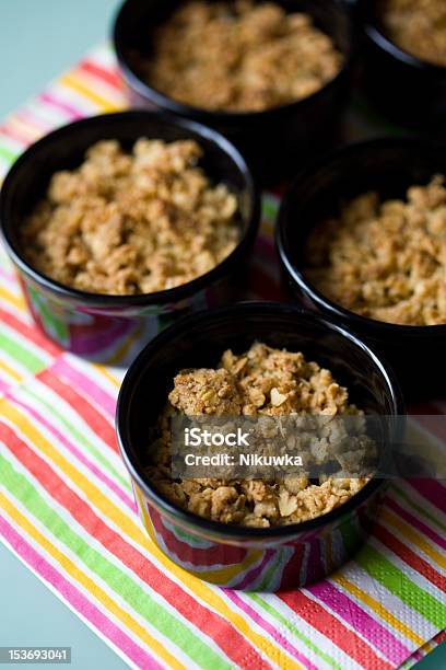 Home Made Apple Crumble In Black Containers Stock Photo - Download Image Now - Apple - Fruit, Baked, Black Box - Container