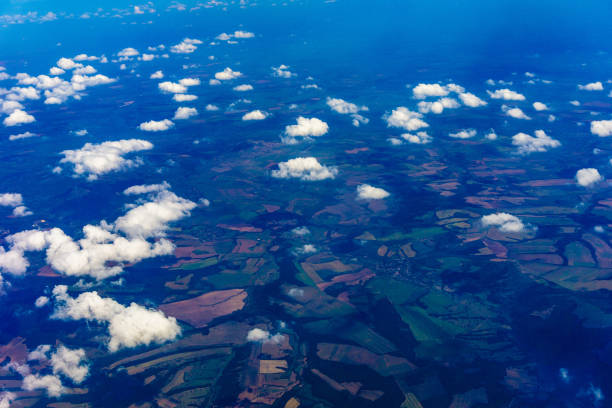 istock View to a land and clouds from airplane 1536931929