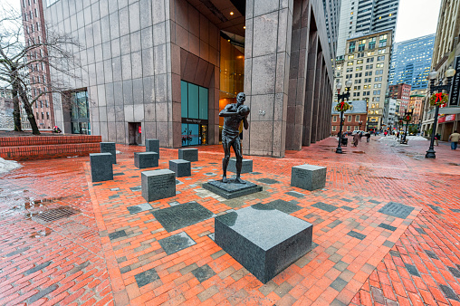 Boston, Massachusetts - January 6, 2014: Boston City Hall and Monument for Basketball Player legend of Celtic great Bill Russell. Massachusetts, USA