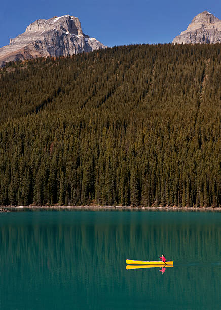 istock Woman Canoeing on Lake Moraine, Alberta, Canada 153693457