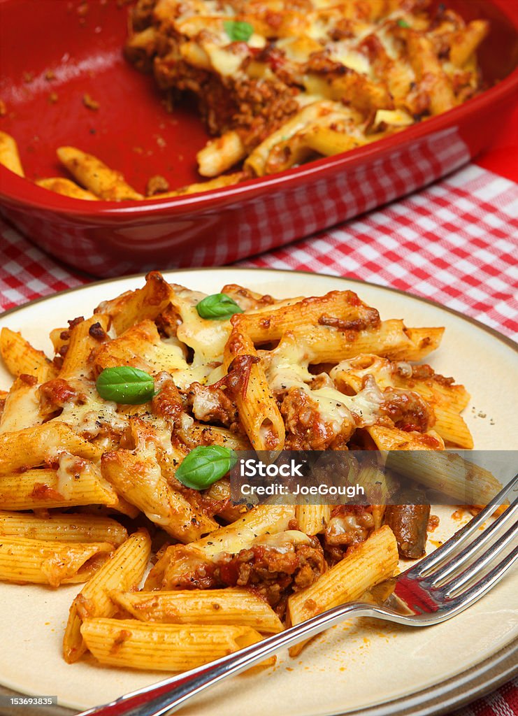 Baked Rigatoni Pasta Meal Baked rigatoni pasta with bolognese sauce and cheese. Baked Stock Photo