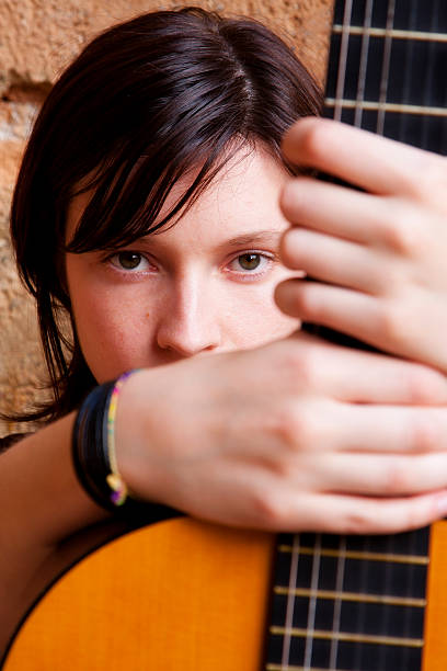 istock Woman holding guitar 153694042