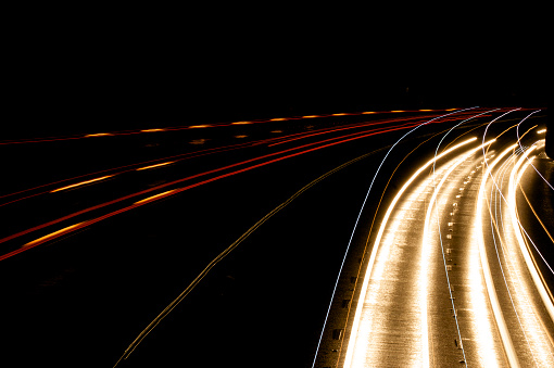 long exposure Headlight Streaks On Motorway by cars in both directions - red and yellow streaks