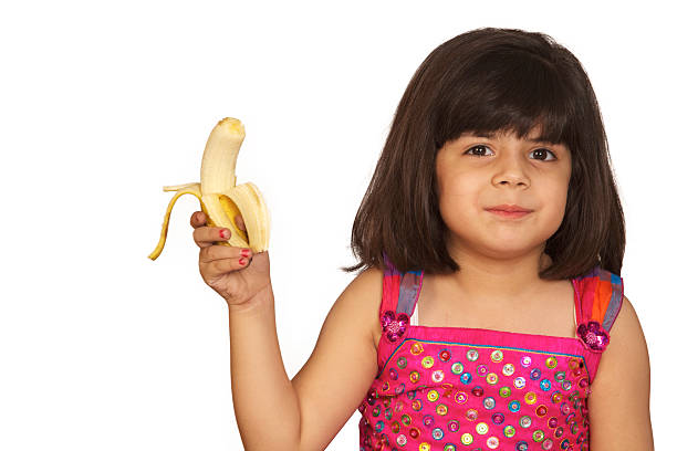 istock girl eating banana 153694352
