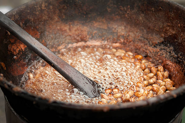 Beans cooking in old rustic pot stock photo