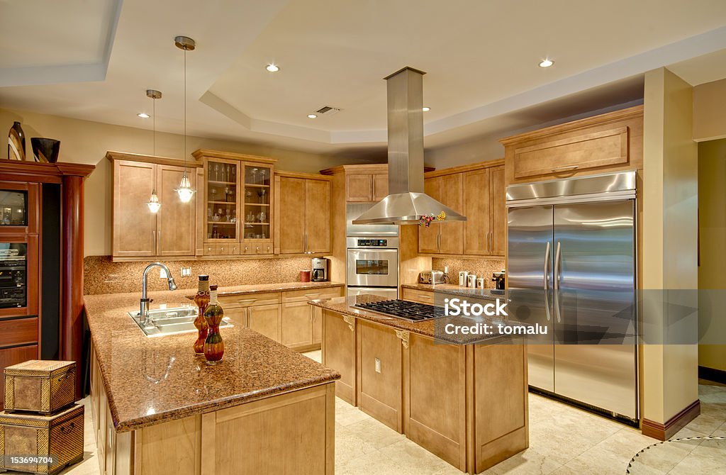 Modern Kitchen View of a modern kitchen with stainless steel appliances. Appliance Stock Photo