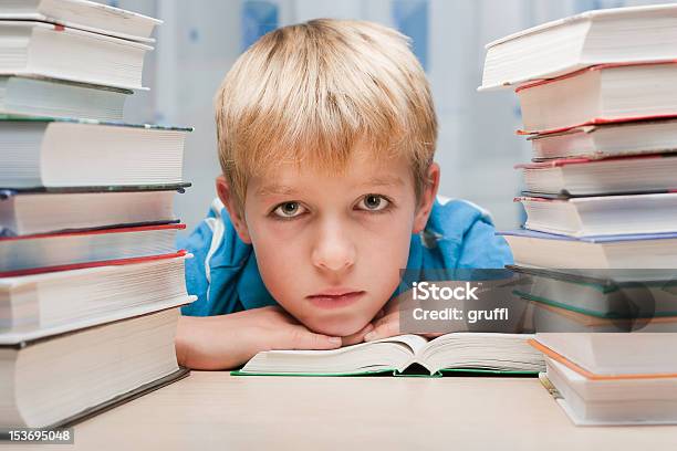 Boy At Desk With Books Stock Photo - Download Image Now - Blond Hair, Blue, Book