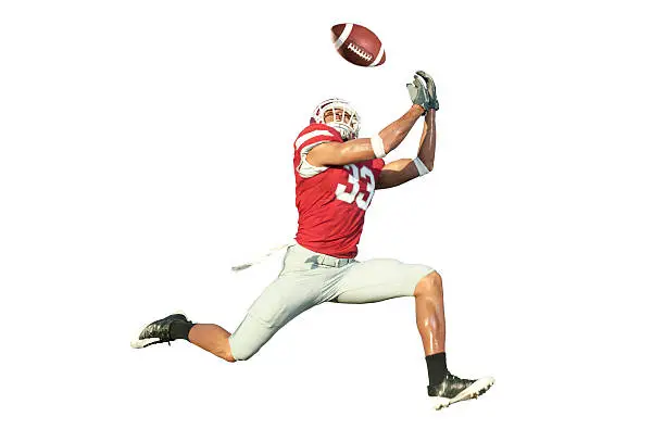 Photo of Football Player Catching a Ball