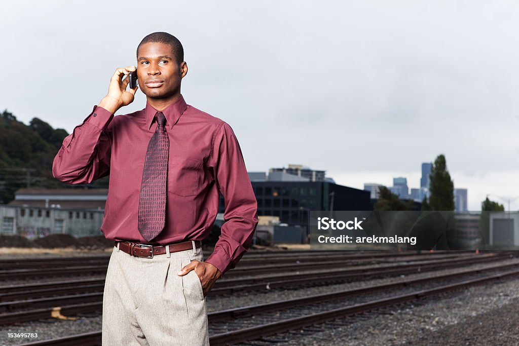 Black businessman on the phone A shot of a black businessman on the phone 20-29 Years Stock Photo
