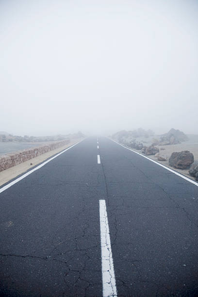 istock road and fog 153696126