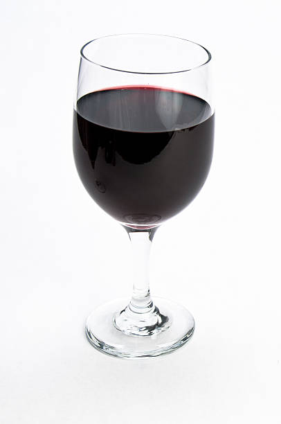 Single glass of red wine on isolating background stock photo