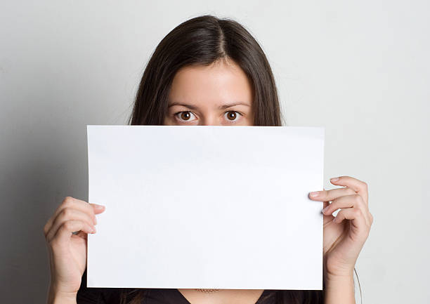 istock Young woman holding a blank sign 153696143
