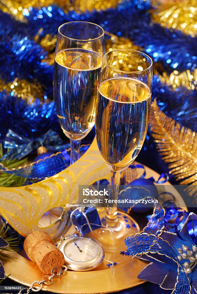 champagne for New Year two glasses of champagne on   golden plate with carnival mask and pocket watch Champagne Stock Photo