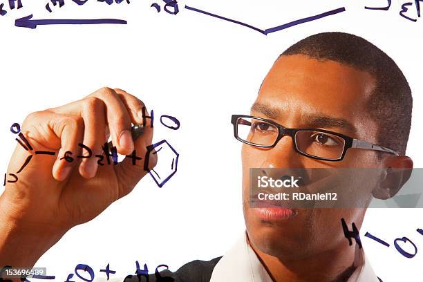 Student Working On An Equation Stock Photo - Download Image Now - Adult, Adults Only, African Ethnicity