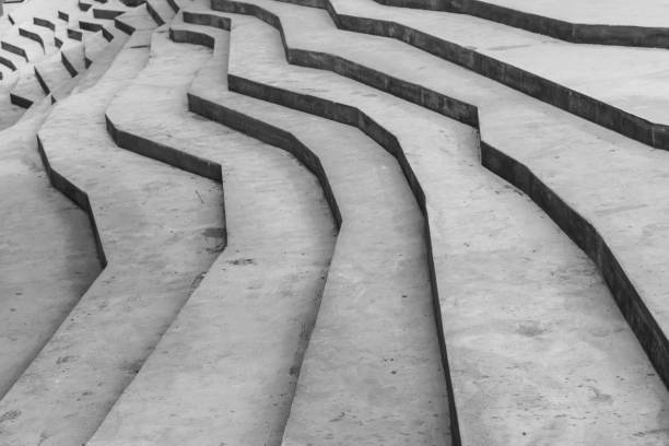 Abstract modern architecture template with gray concrete stairs in polygonal geometric shape, background photo with selective focus
