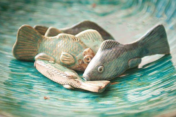 istock Fishes on the green bowl. 153697888