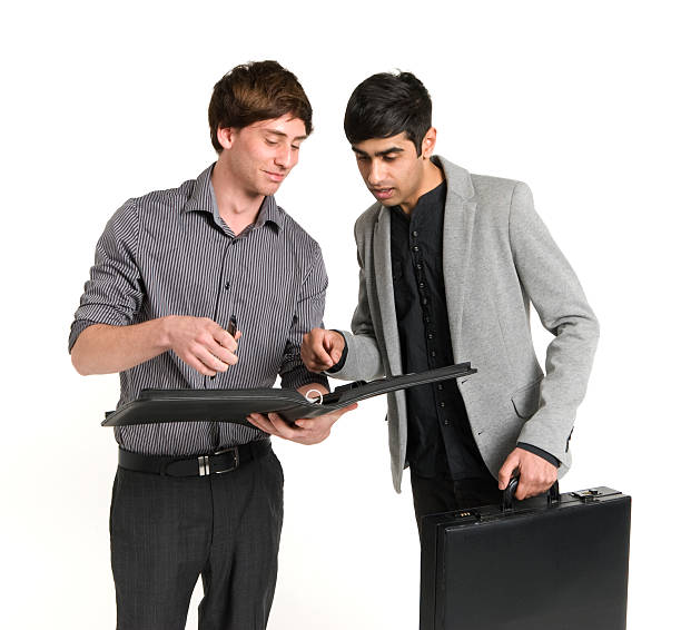 Two Business Men Reading stock photo