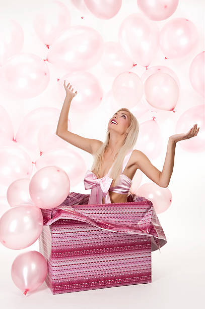 istock young girl as a gift in balloons 153698946