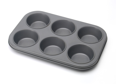 Muffin and cupcake pan on white background