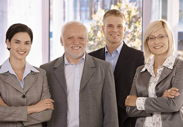 Portrait of businessteam Portrait of smiling businessteam standing in office. organized group photos stock pictures, royalty-free photos & images