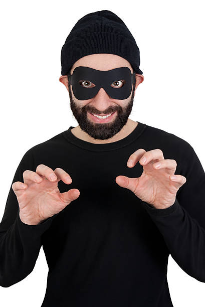 Thief looking straight at camera stock photo