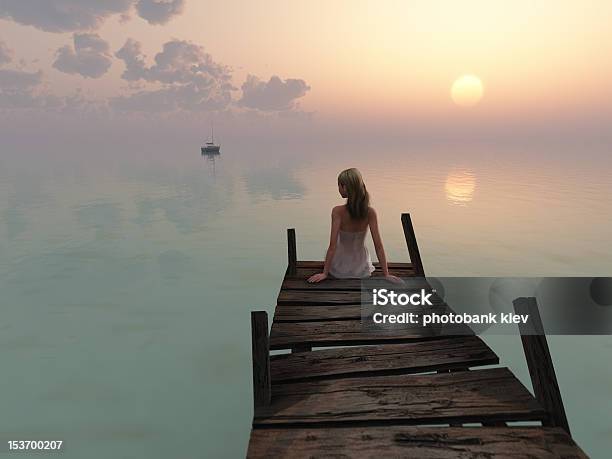 Woman Sitting On Pier At Sunrise Stock Photo - Download Image Now - Adult, Beach, Beautiful People