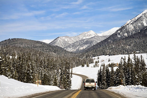 Truck Traveling on a Highway in Montana During Winter stock photo