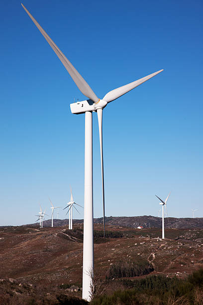 mountain with windmills power stock photo