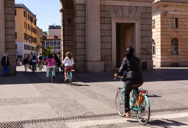 Milan Italy - April 26, 2023: Rent bikes. A large group of cyclists in Garibaldi district