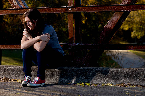 istock Lonely Girl on a Bridge 153702315