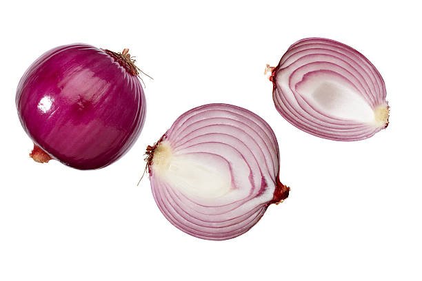 Whole and halves of red onions on white background Red onion on a white background spanish onion stock pictures, royalty-free photos & images