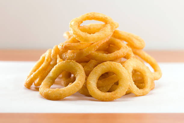 istock Onion ring on a waxed white paper 153703724