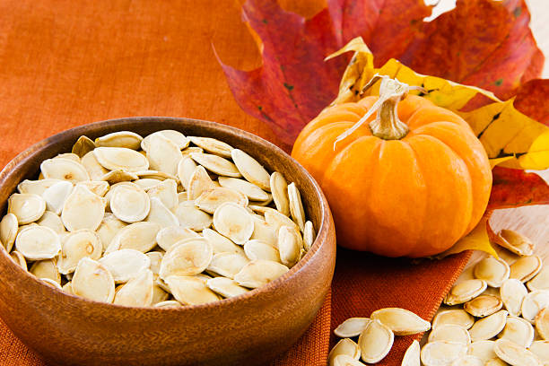 istock Horizontal image of pumpkin seeds with copy-space 153704882