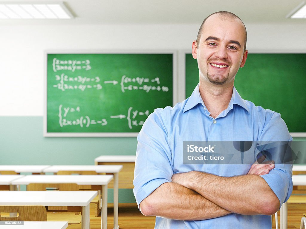 confident teacher confident young caucasian teacher in a class Adult Stock Photo