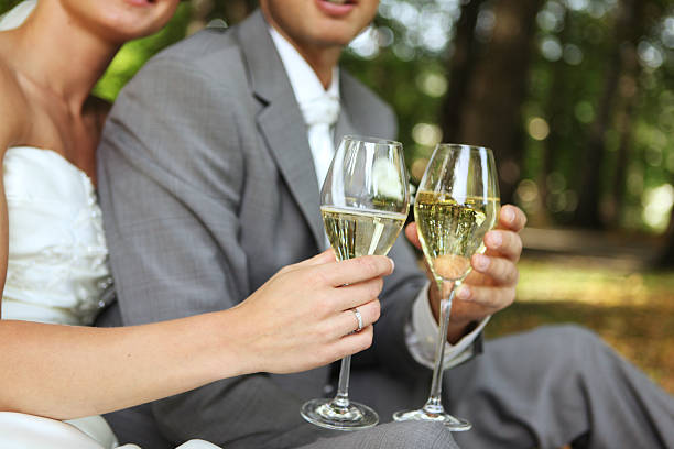 istock Bride and Groom holding champagne glasses 153705922