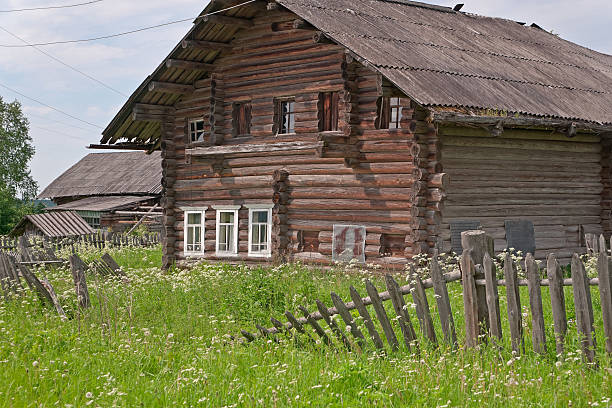 istock Old wood house with lopsided broken palisade before. 153707227