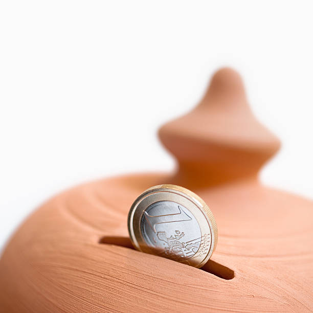 moneybox and coin stock photo