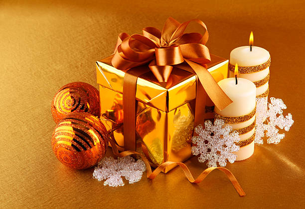 istock christmas gift in gold box with bow 153707958