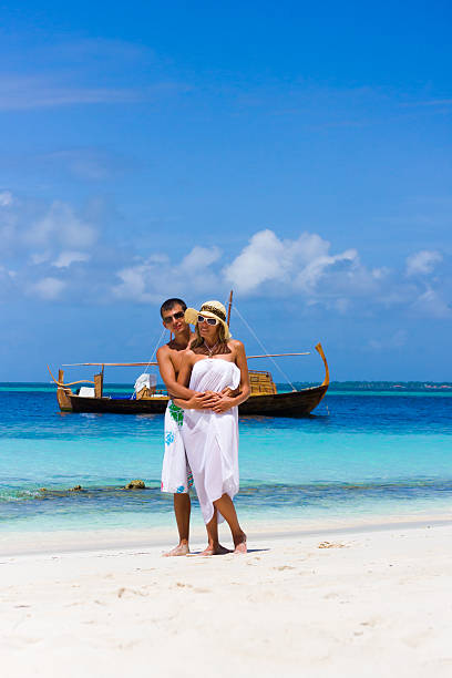 istock Young couple a beach on background the yacht 153708533