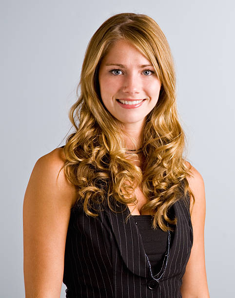 istock Young woman with long hair smiling 153709024