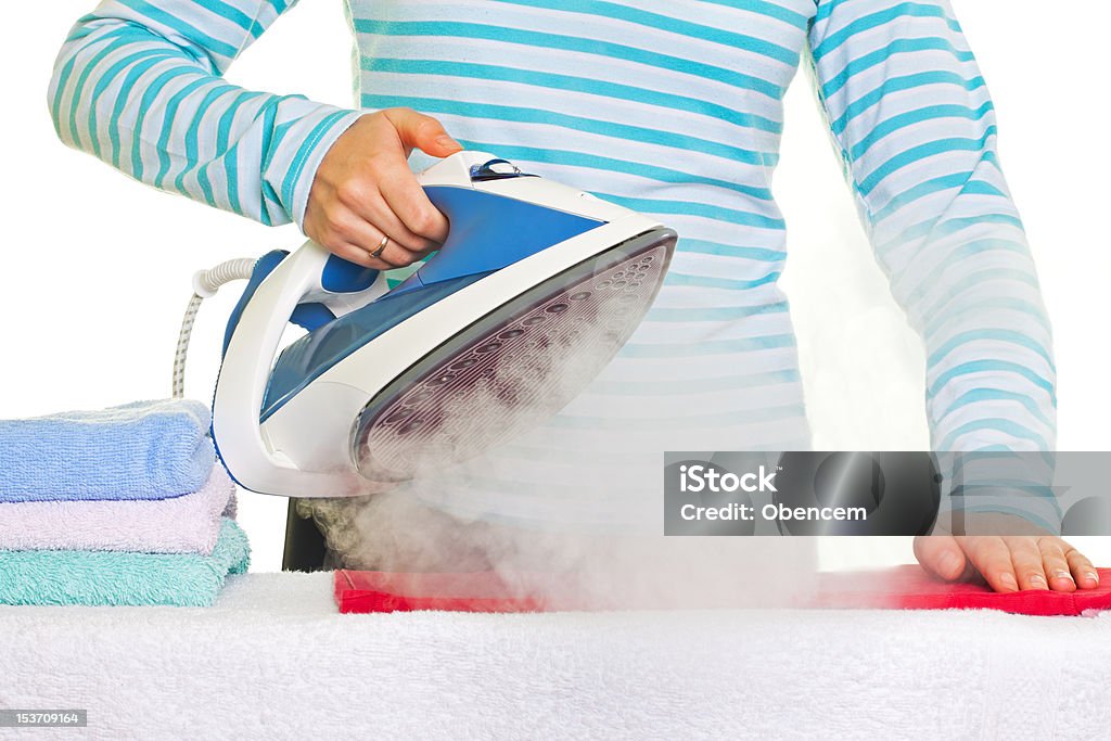 Young lady ironing her clothes Sweet young lady ironing her clothes Adult Stock Photo