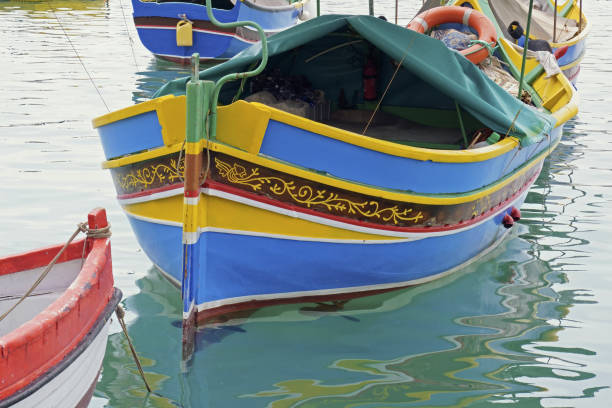 istock luzzu anchored in Marsaxlokk harbour, Malta 1537095191