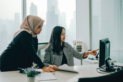 A Director review  and discussion with her manager in office