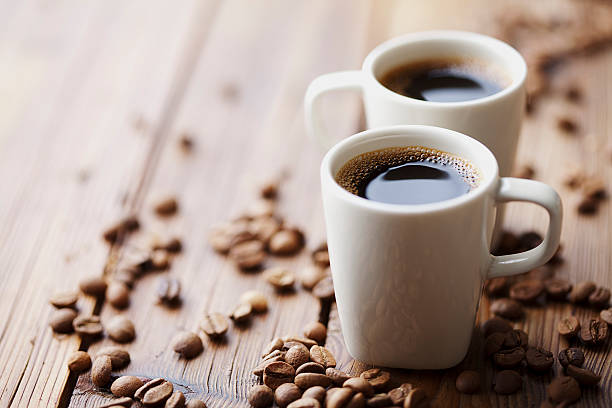 istock Two cups of expresso surrounded by coffee beans 153711182